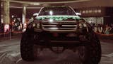 gta online white karin everon vehicle with green and black flame details on podium in diamond casino front view